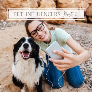 Girl Influencer with cell phone and her dog taking a selfie